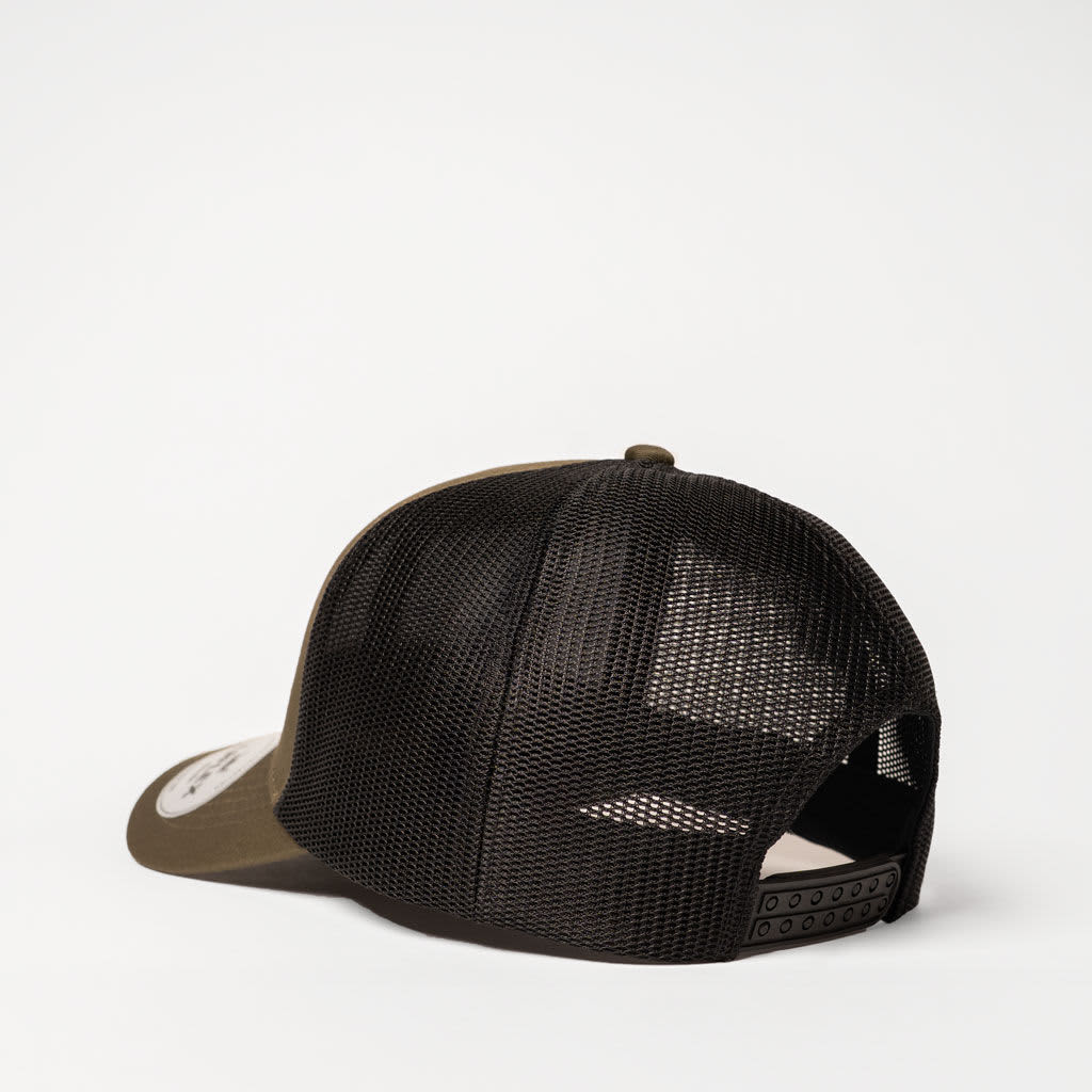 A green and black trucker cap featuring a mesh back and an adjustable strap. It includes a logo on the front.