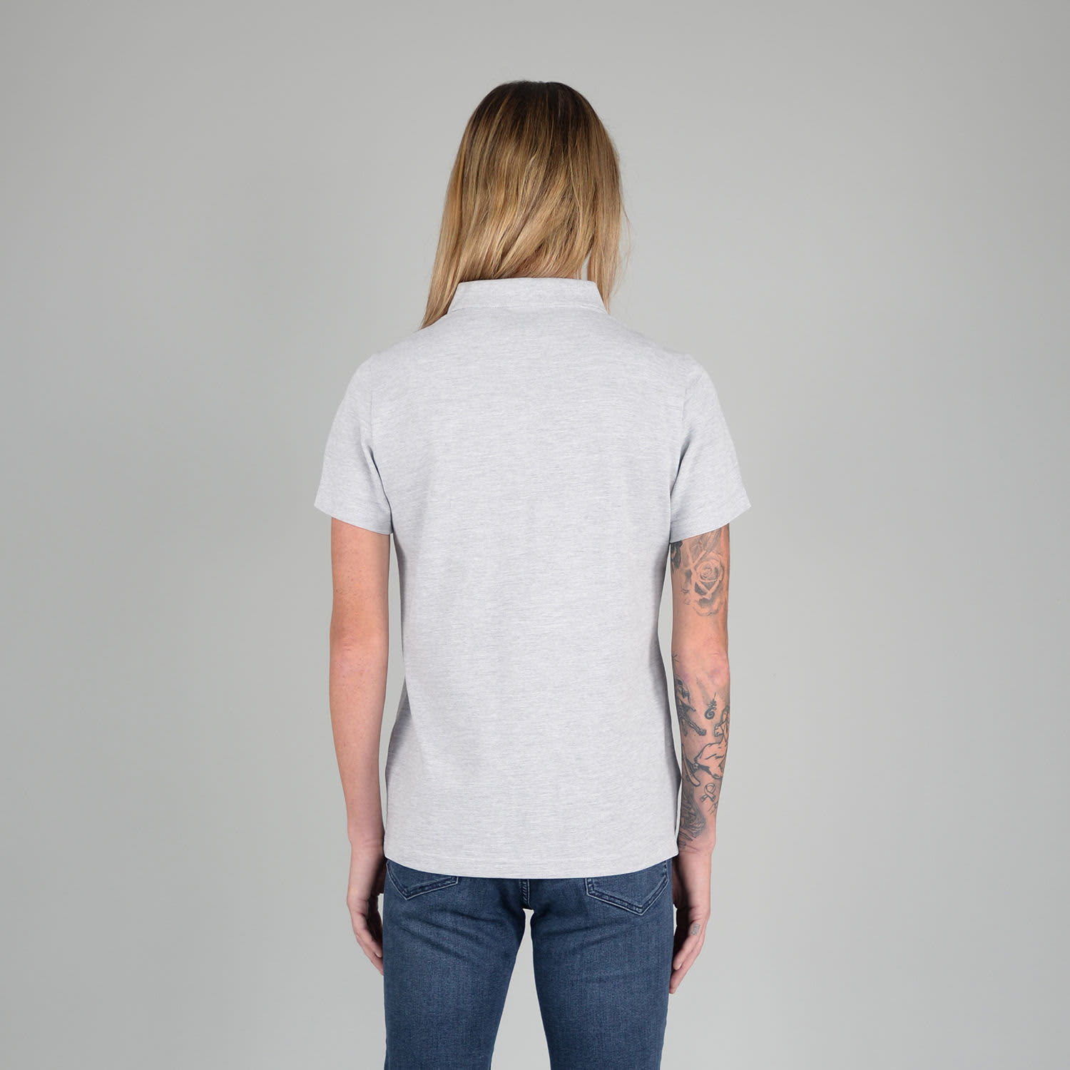 A grey ladies polo shirt featuring a classic collar and short sleeves, displayed from the back.