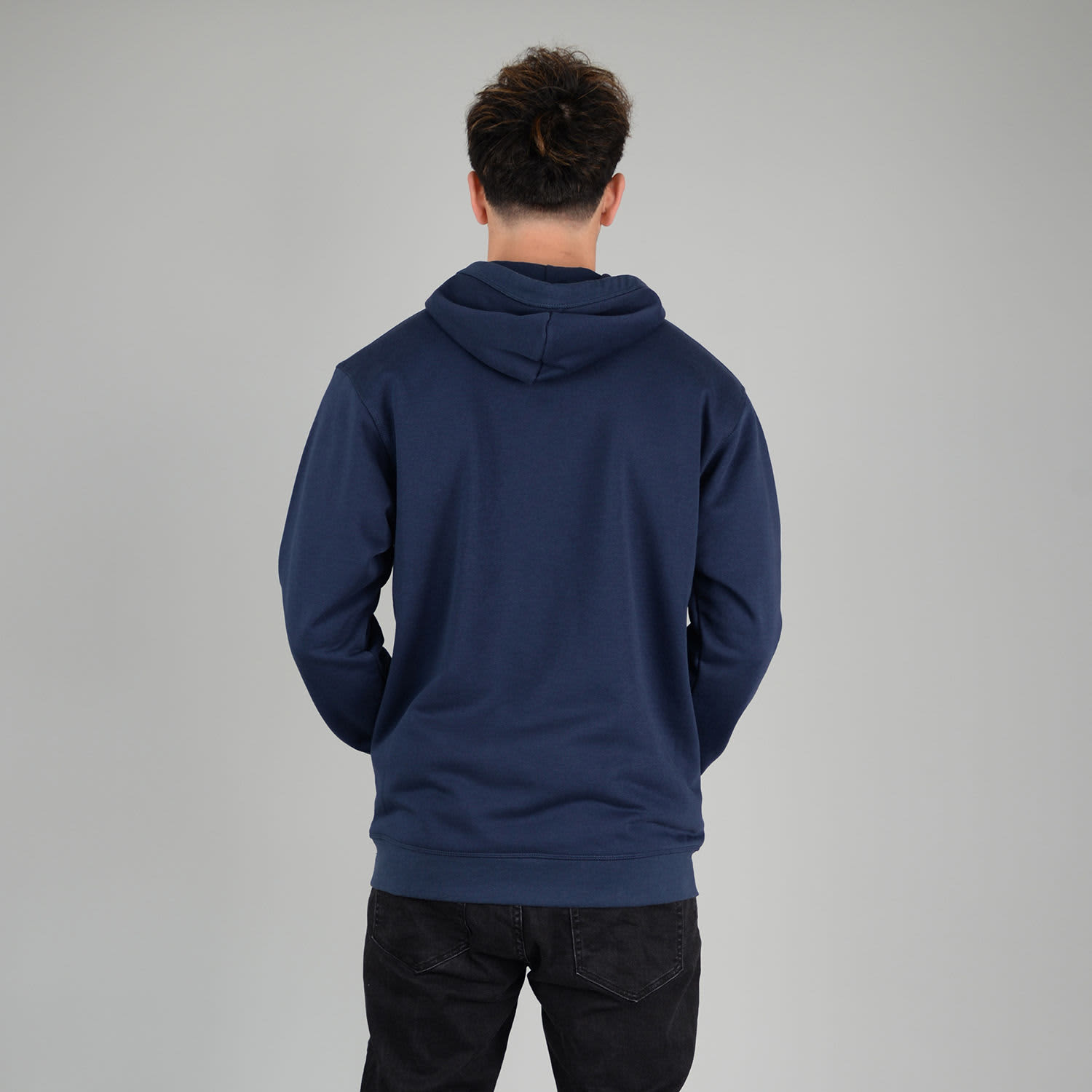 A navy zip hoodie with a hood, viewed from the back, featuring a plain design and a logo on the garment.
