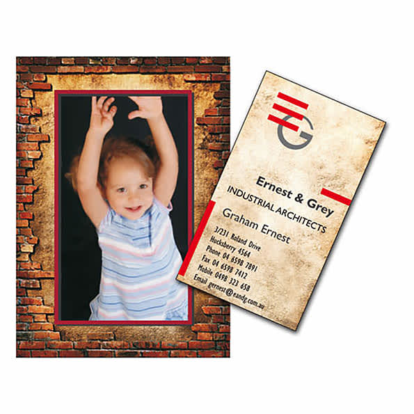 A magnetic photo frame featuring a brick pattern and a colourful image of a child, alongside a business card with a logo.