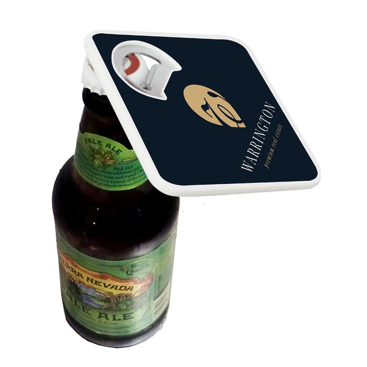 A drink bottle with a black and white coaster attached, featuring a built-in bottle opener and a logo.