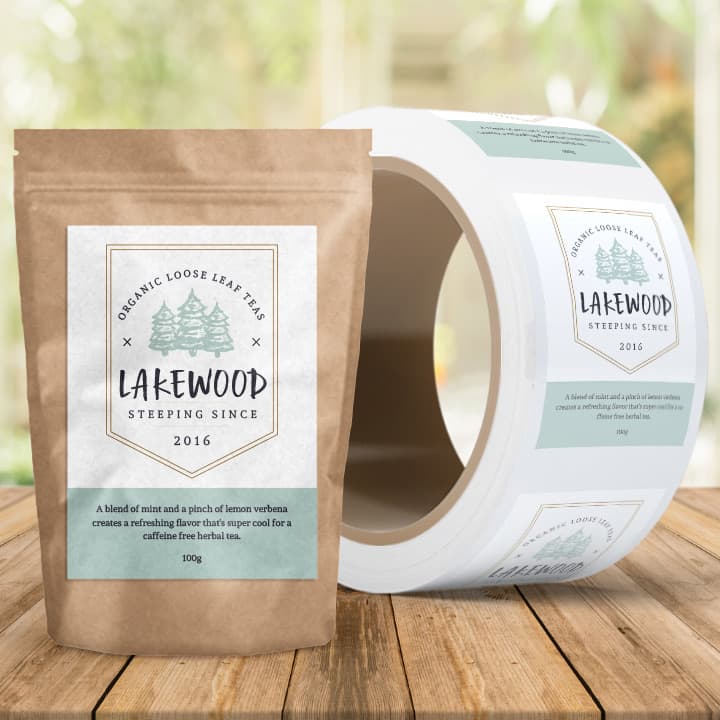 A roll of stickers featuring a logo and packaging design for Lakewood organic loose leaf tea in natural colours.
