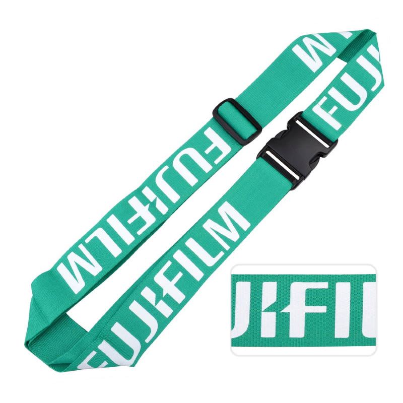 A green luggage belt featuring a branding logo and a sturdy buckle.