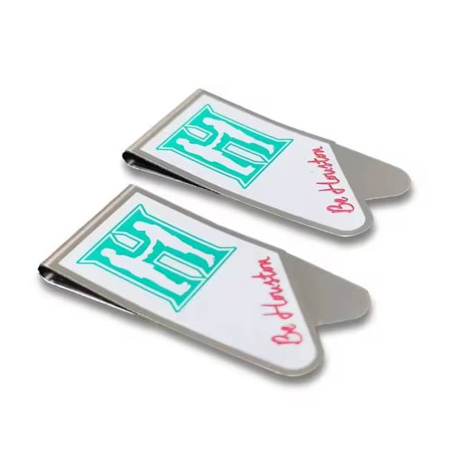 A set of two silver paper clips with a white and turquoise design and a branding logo.