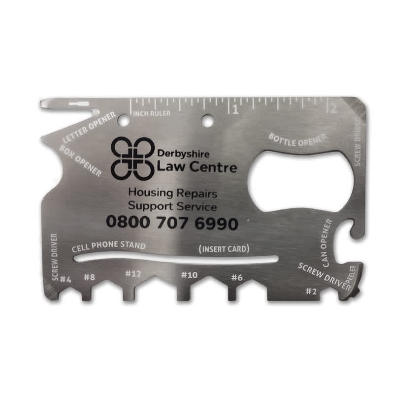 A silver multi-tool credit card size with various functions like a bottle opener and screwdrivers, featuring engravings and a logo.