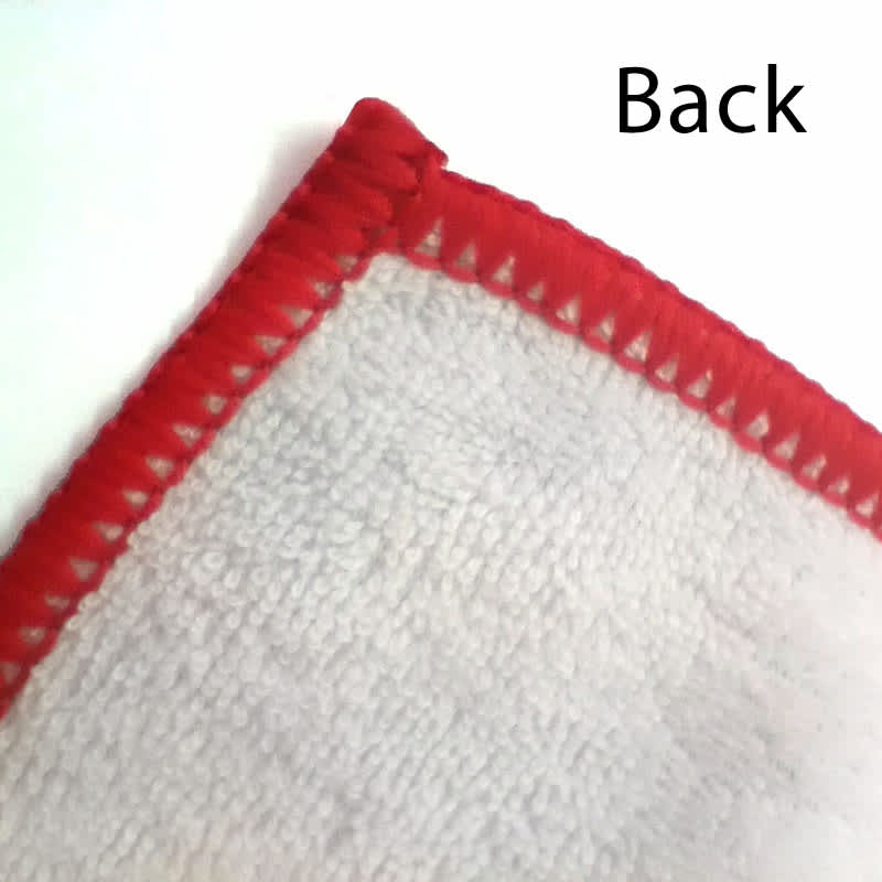 A close-up of a custom polyester tea towel with a red hem, showcasing the back texture.