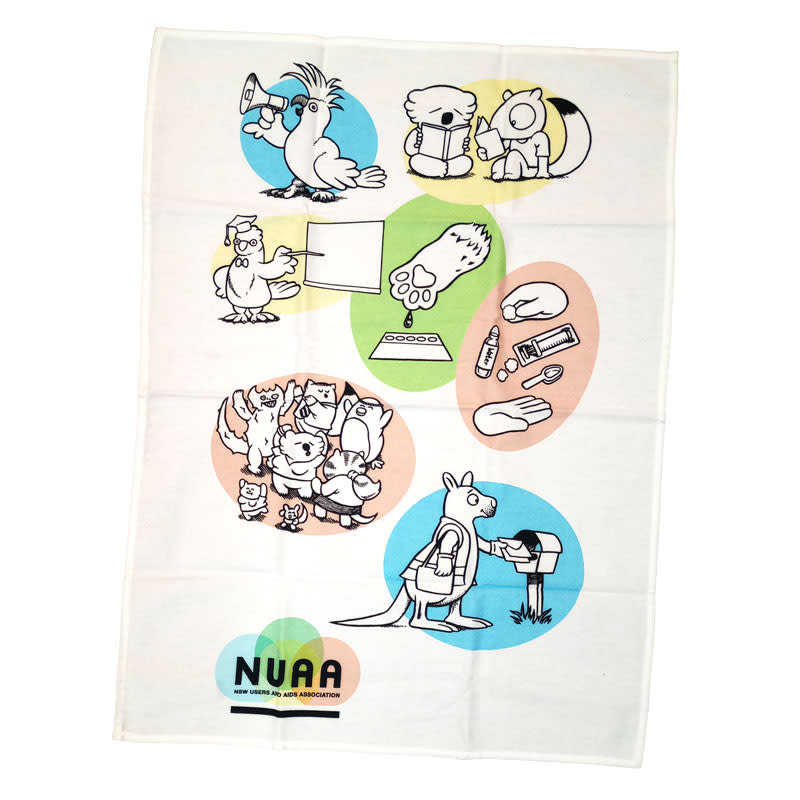 A white cotton tea towel featuring colourful cartoon illustrations and a logo at the bottom.