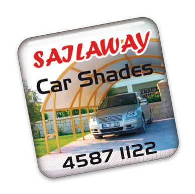 A square fridge magnet featuring a car under a shade structure, with a logo and contact details in bold text.