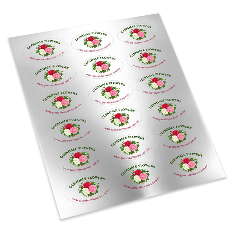 A sheet of oval paper stickers featuring floral designs in pink and green, with a logo and website details.