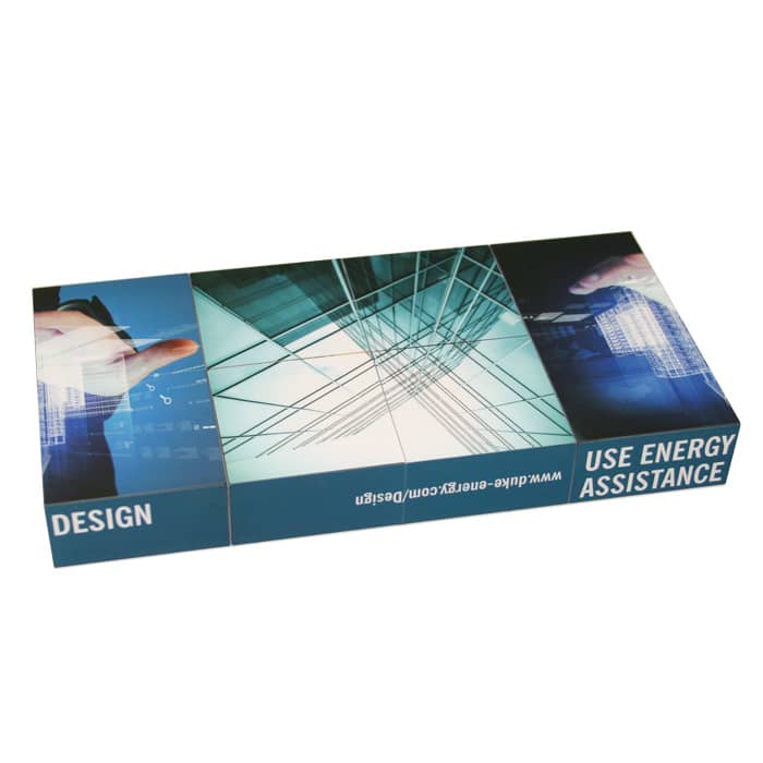 A promotional cube featuring multiple images and a blue colour scheme, with a logo visible on it.