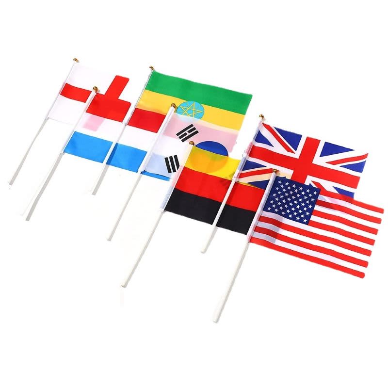 A set of small hand flags in various colours, including the flags of the USA, UK, Germany, and more on white poles.