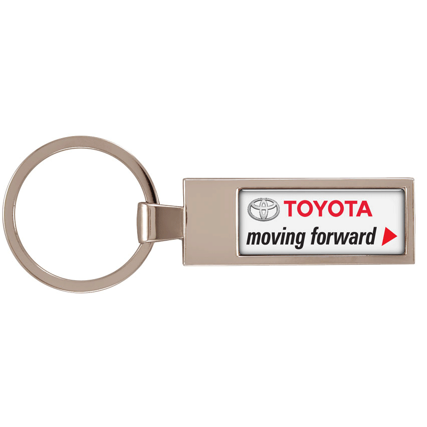 A metal keyring with a rectangular pendant, featuring a logo and text in red and black on a white background.