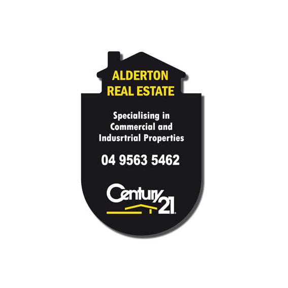 A black real estate sign with a house shape, featuring yellow text and a logo at the bottom.