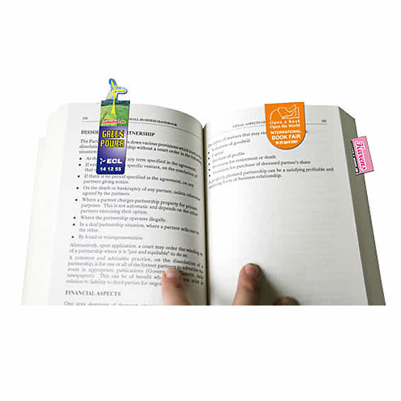 A book open to a page with two colourful magnetic bookmarks attached, featuring different designs and a logo.