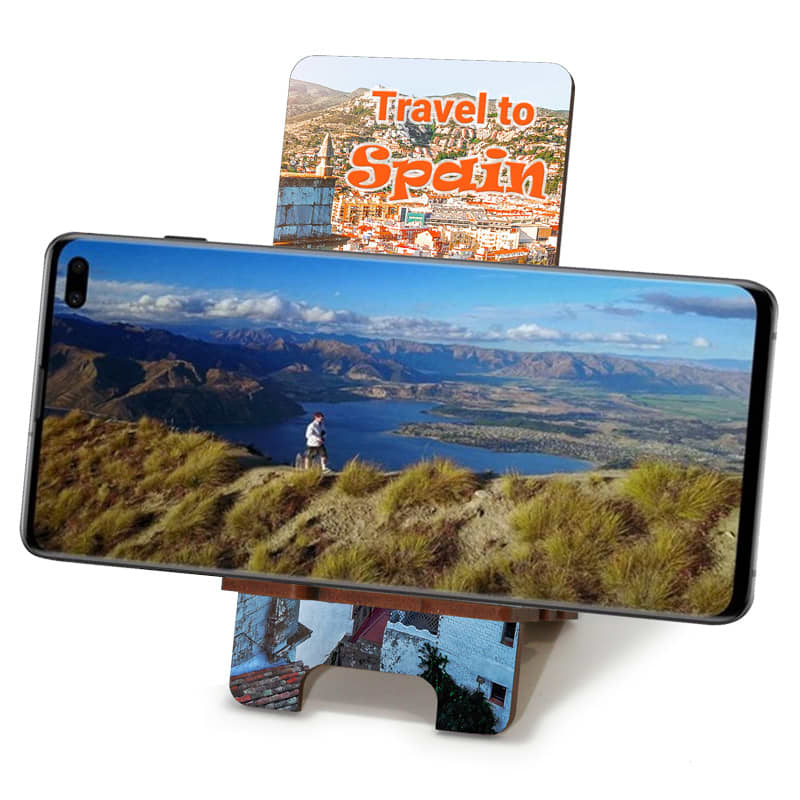 Eco MDF full colour phone holder with a scenic landscape design, featuring a smartphone propped up against it.