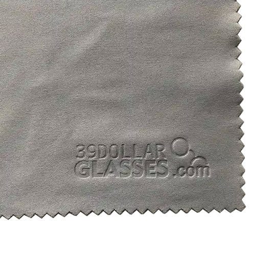 A grey microfibre lens cloth with an embossed logo, suitable for cleaning delicate surfaces.