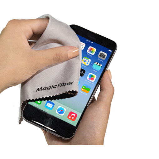 A hand using a grey microfibre lens cloth to clean a smartphone screen. The cloth features a logo.