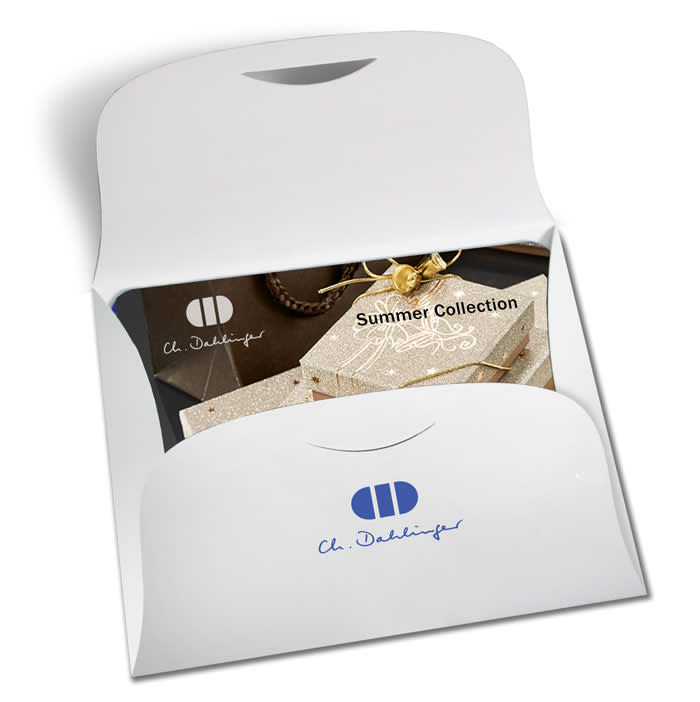 A white presentation folder with a logo, featuring a display of a summer collection inside.