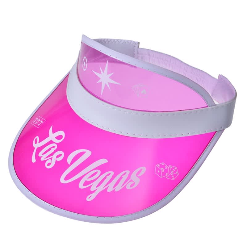 A pink PVC sun visor with a white band and a logo. Features designs related to Las Vegas.