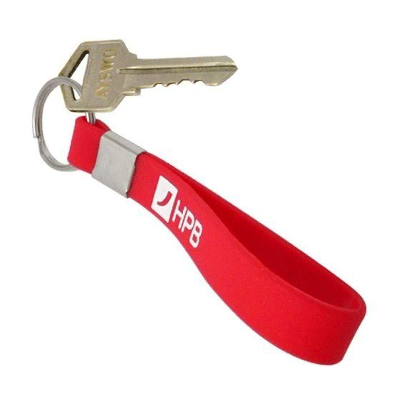 A red silicone loop keyring with a metal attachment and a key. It features a logo on the strap.