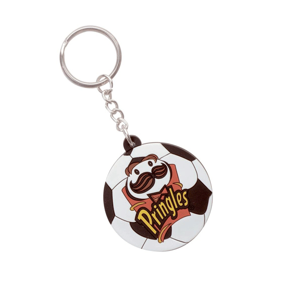 A PVC soft keyring featuring a football design in black and white with a logo on one side.
