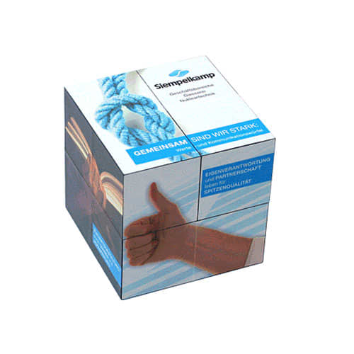 A clear promotional cube featuring various images and a logo, predominantly in blue and white colours.