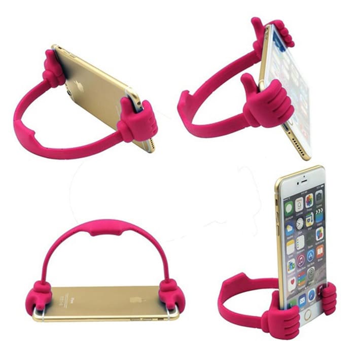 A pink phone and tablet holder shaped like hands, designed to support devices in an upright position.