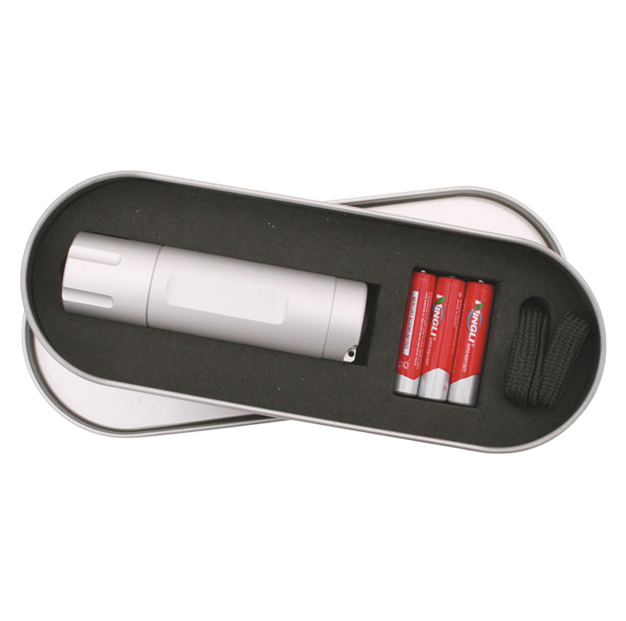 A silver LED torch with batteries, displayed inside a metal tin. The tin has a black inner lining.
