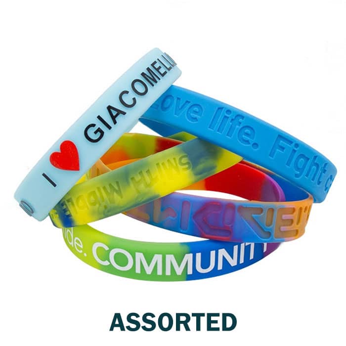 Assorted silicone wristbands in various colours, featuring different messages and a logo on one band.