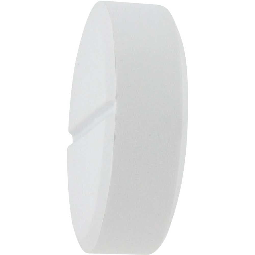 A round white tablet-shaped stress reliever with a smooth surface and a central groove.