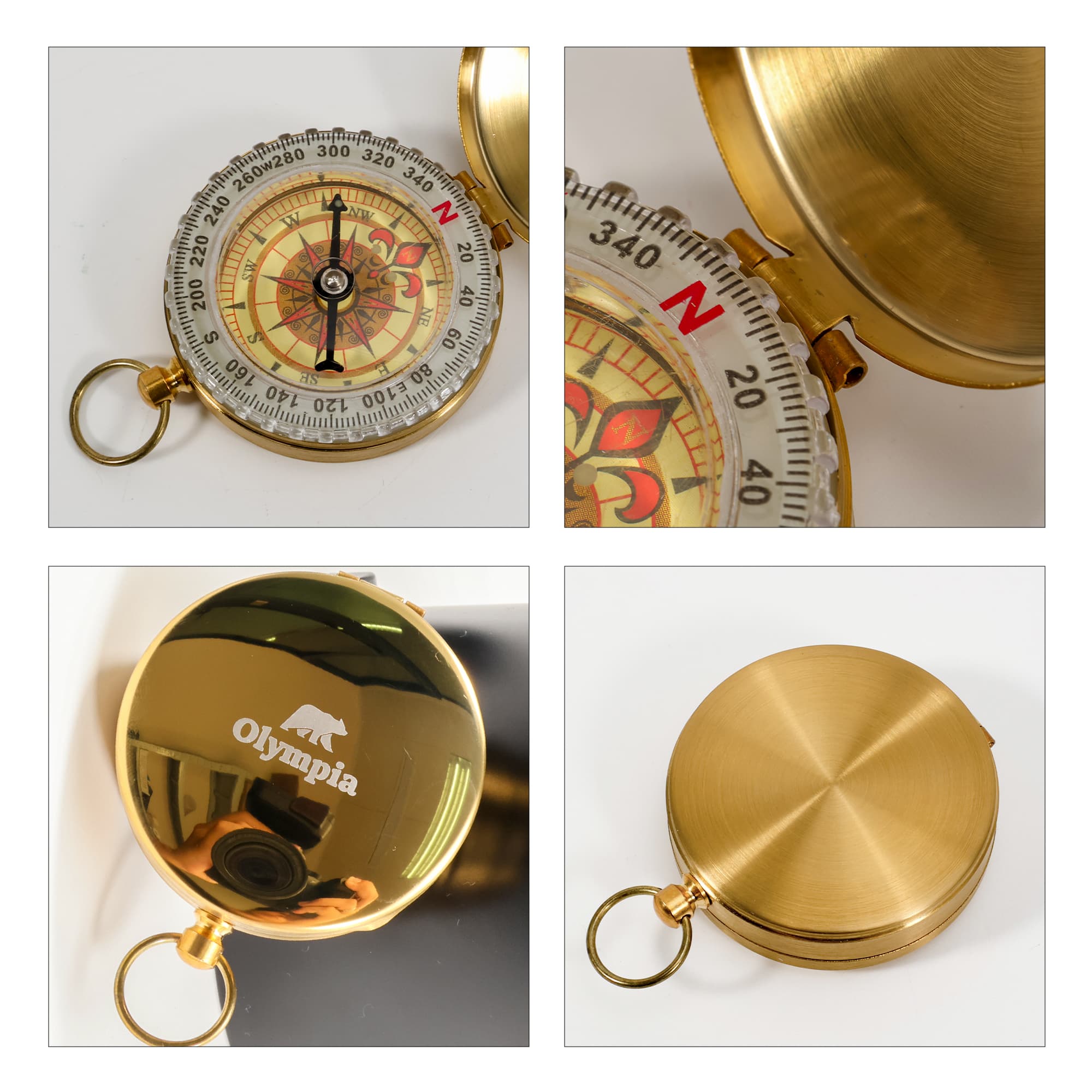 A gold compass with a decorative face, featuring a logo on the glossy surface and a ring for attachment.