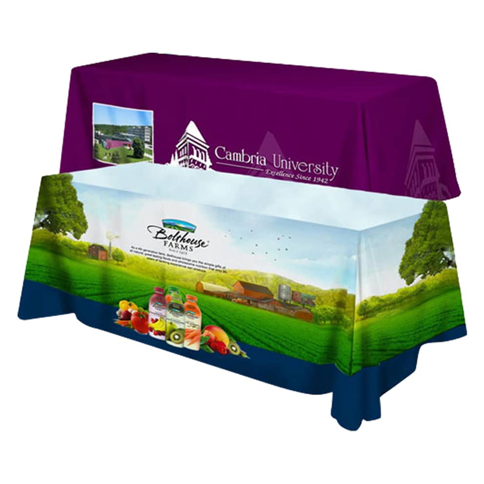 A promotional tablecloth with a purple top featuring a logo and a blue bottom with a landscape design and branding.