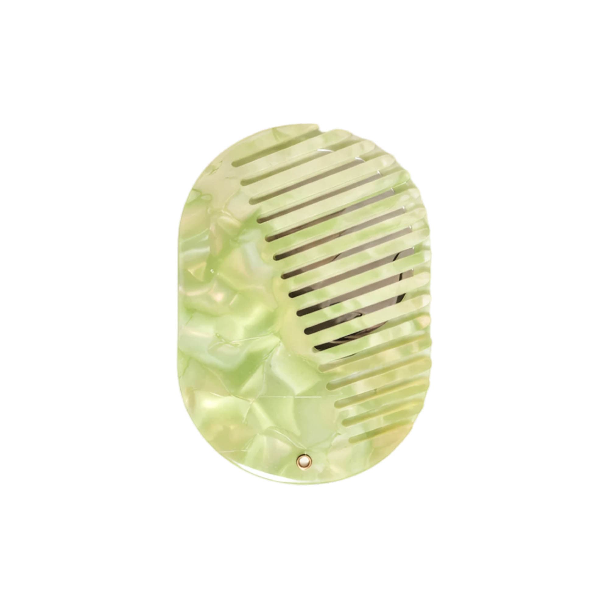 A portable green acetate hair comb with a mirror, featuring a textured design and a compact shape.