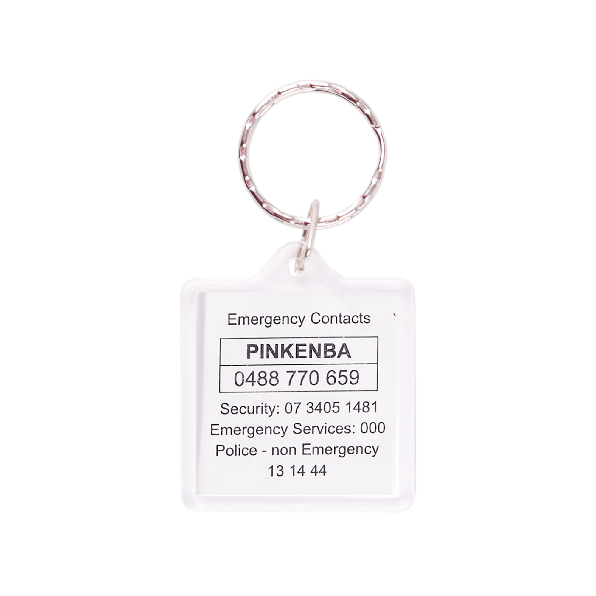 A clear square acrylic keyring with a silver metal ring, displaying emergency contact information.