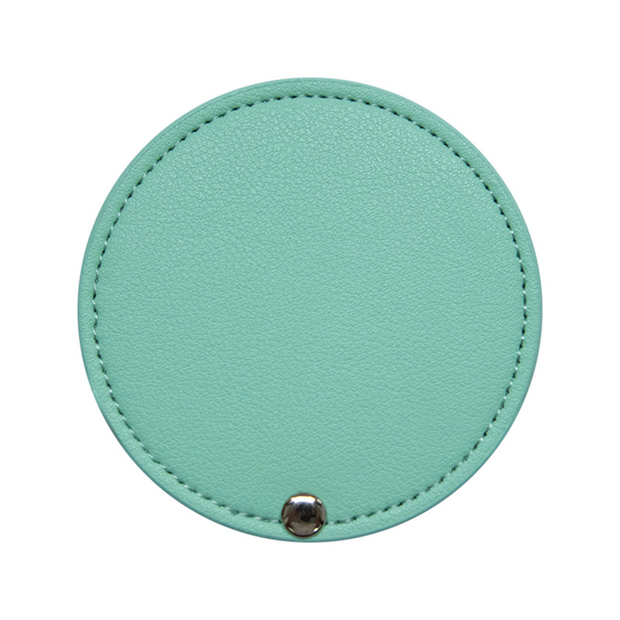 A round makeup mirror in mint green with a textured surface and a silver snap button.