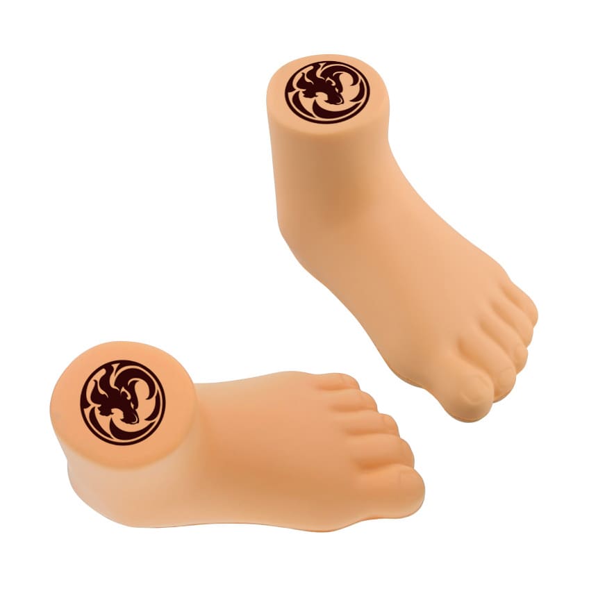 A leg-shaped stress reliever in a peach tone, featuring a circular logo on top.