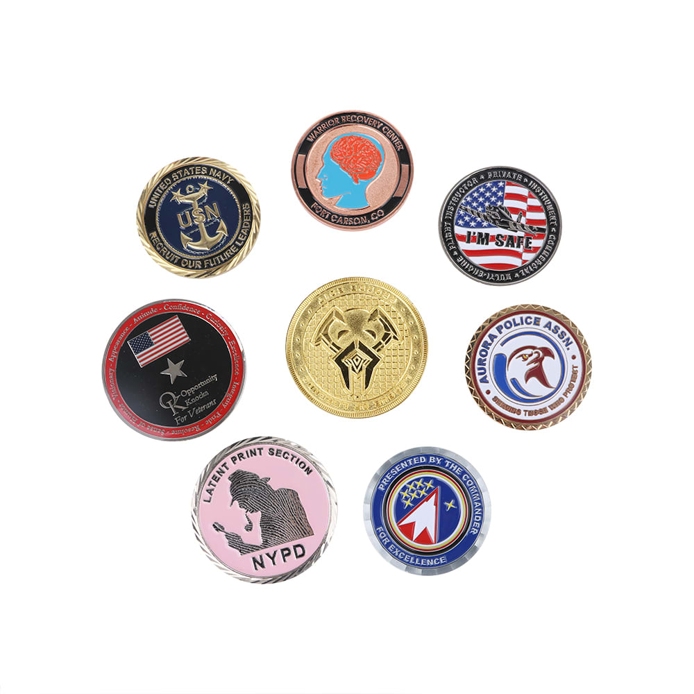 A collection of commemorative gold coin pins in various colours and designs, featuring different logos and emblems.