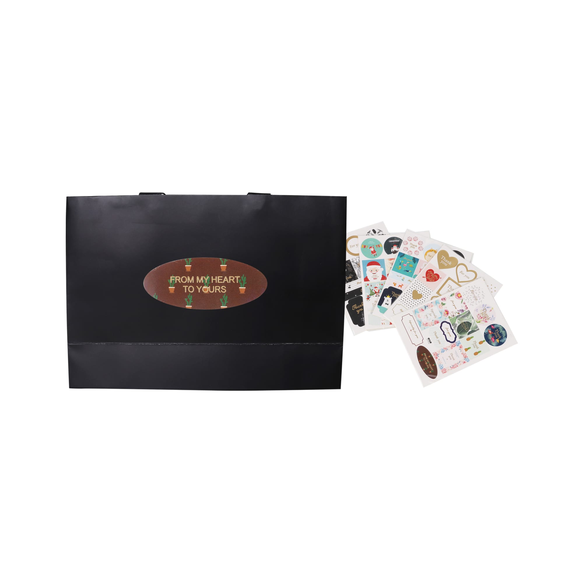 A medium black paper bag with flat handles, accompanied by assorted decorative stickers.