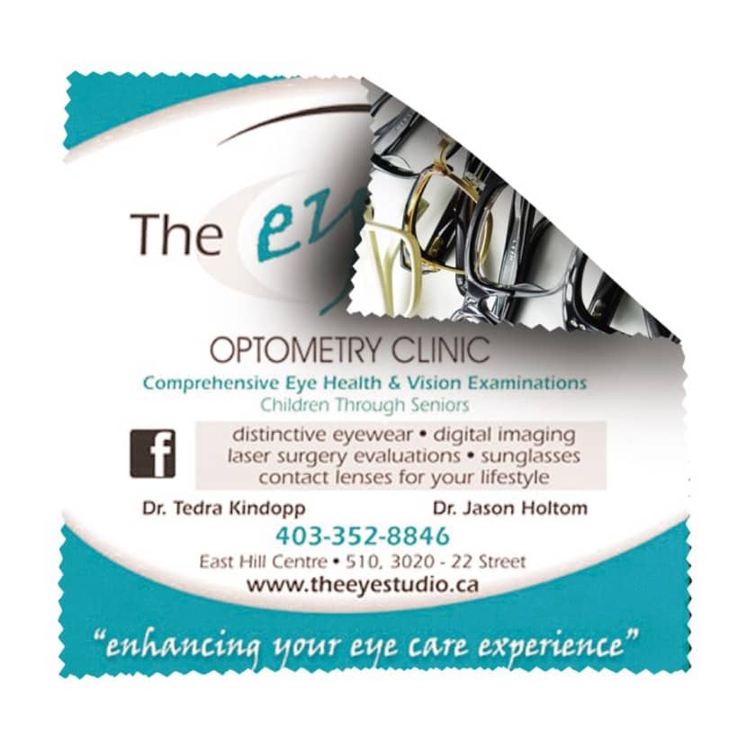 A microfibre lens cloth in teal and white with a logo, featuring a patterned design of eyeglasses.