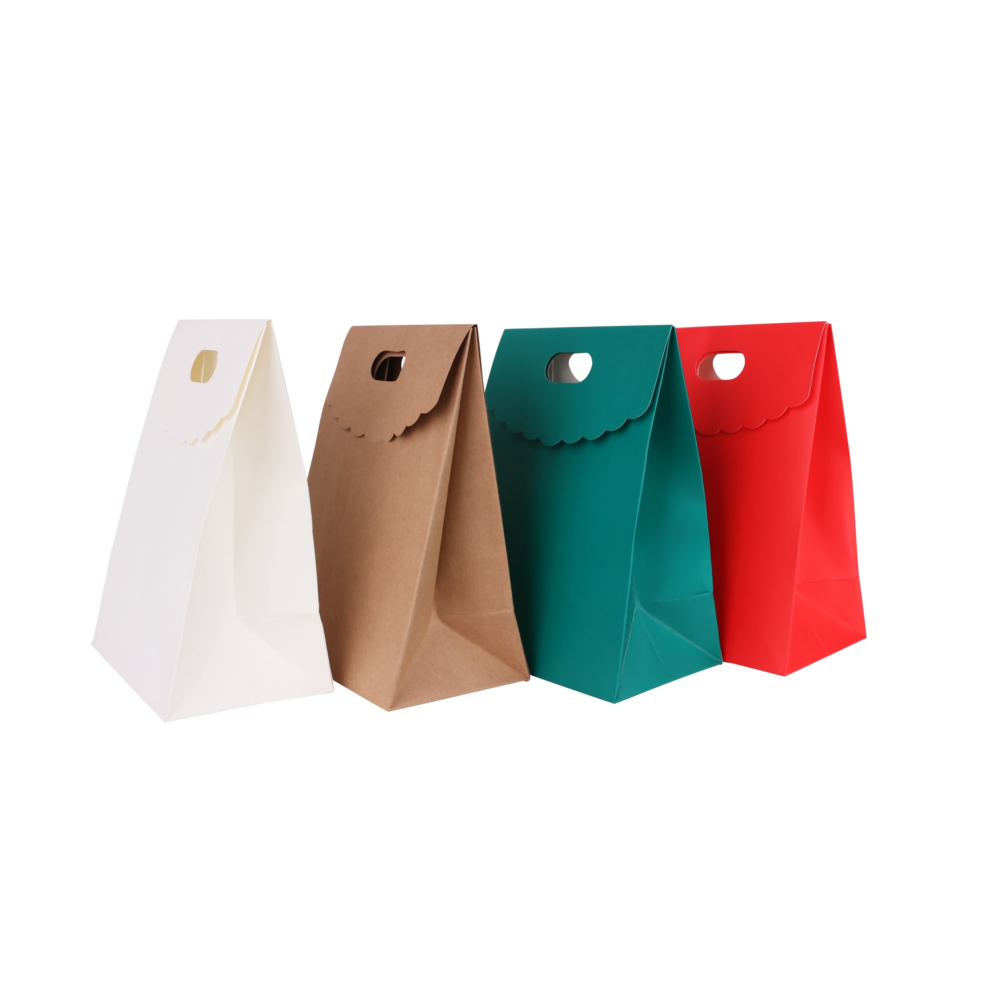 A set of four die cut handle bags in white, brown, teal, and red, each with a flap and cut-out handle.