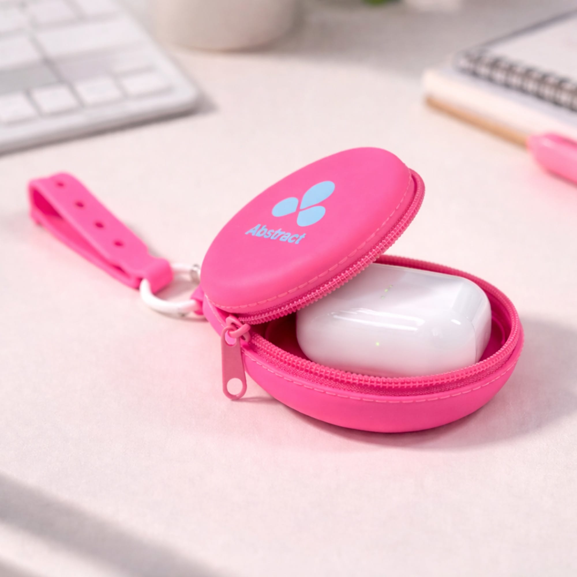 A pink silicone pouch with holes strap, unzipped to reveal white contents inside, on a light surface.