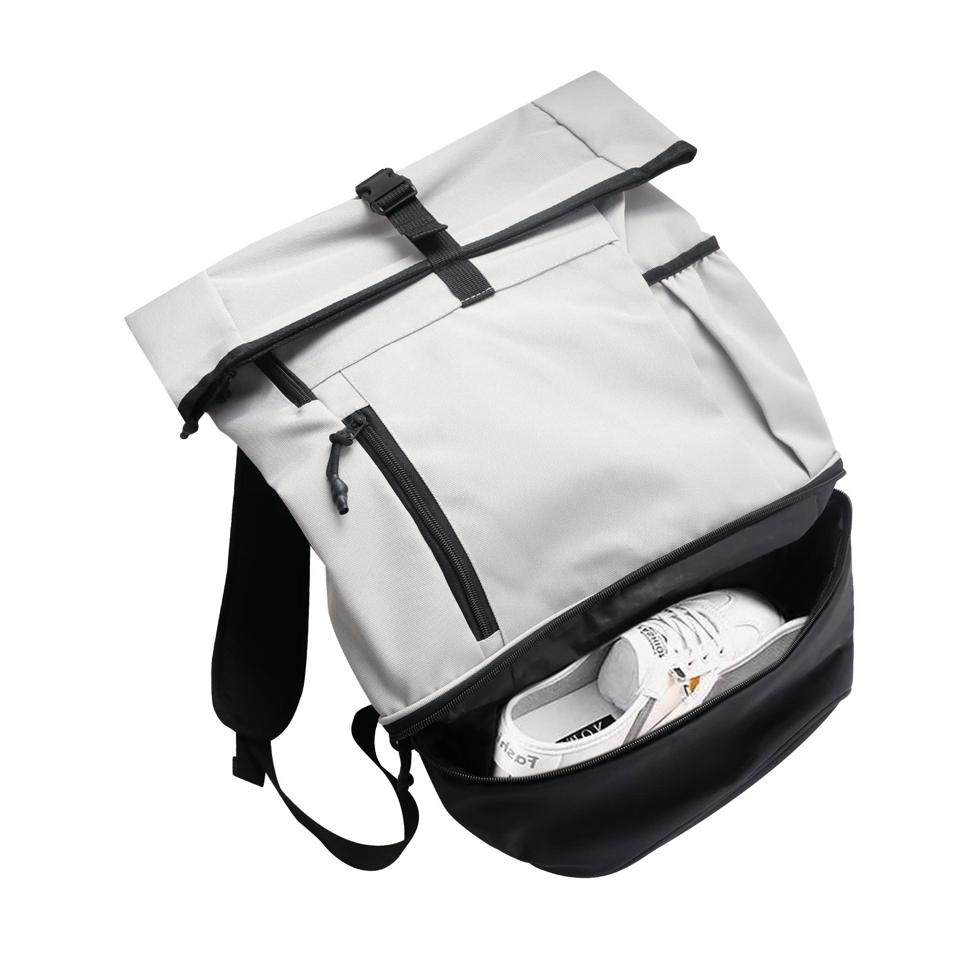 A grey and black roll-top backpack with zippered pockets, featuring a pair of white sneakers inside.