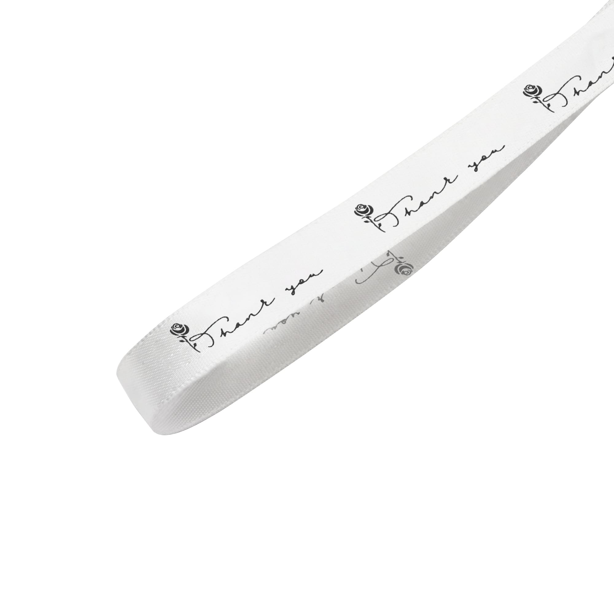 A white cotton ribbon featuring black printed text and a rose design, with a logo on the side.