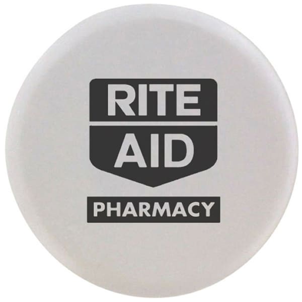 A round white stress reliever designed in the shape of a tablet with a logo.