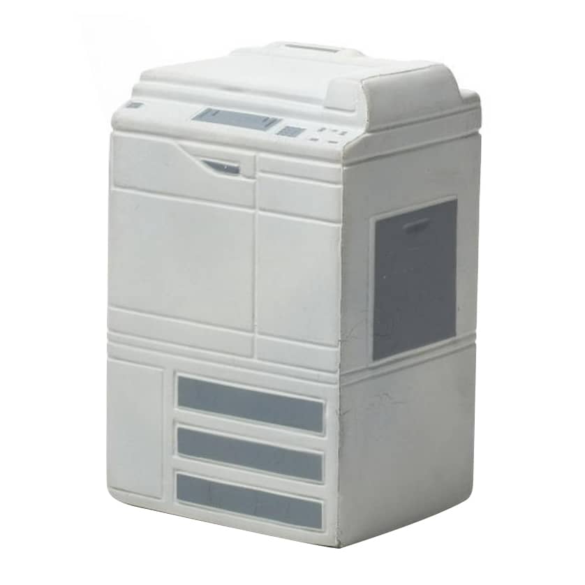 A white photocopier-shaped stress reliever with grey details and a logo. Ideal for stress relief and fun.