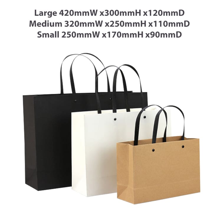 Three paper bags in black, white, and brown, featuring knitted handles, displayed in various sizes.