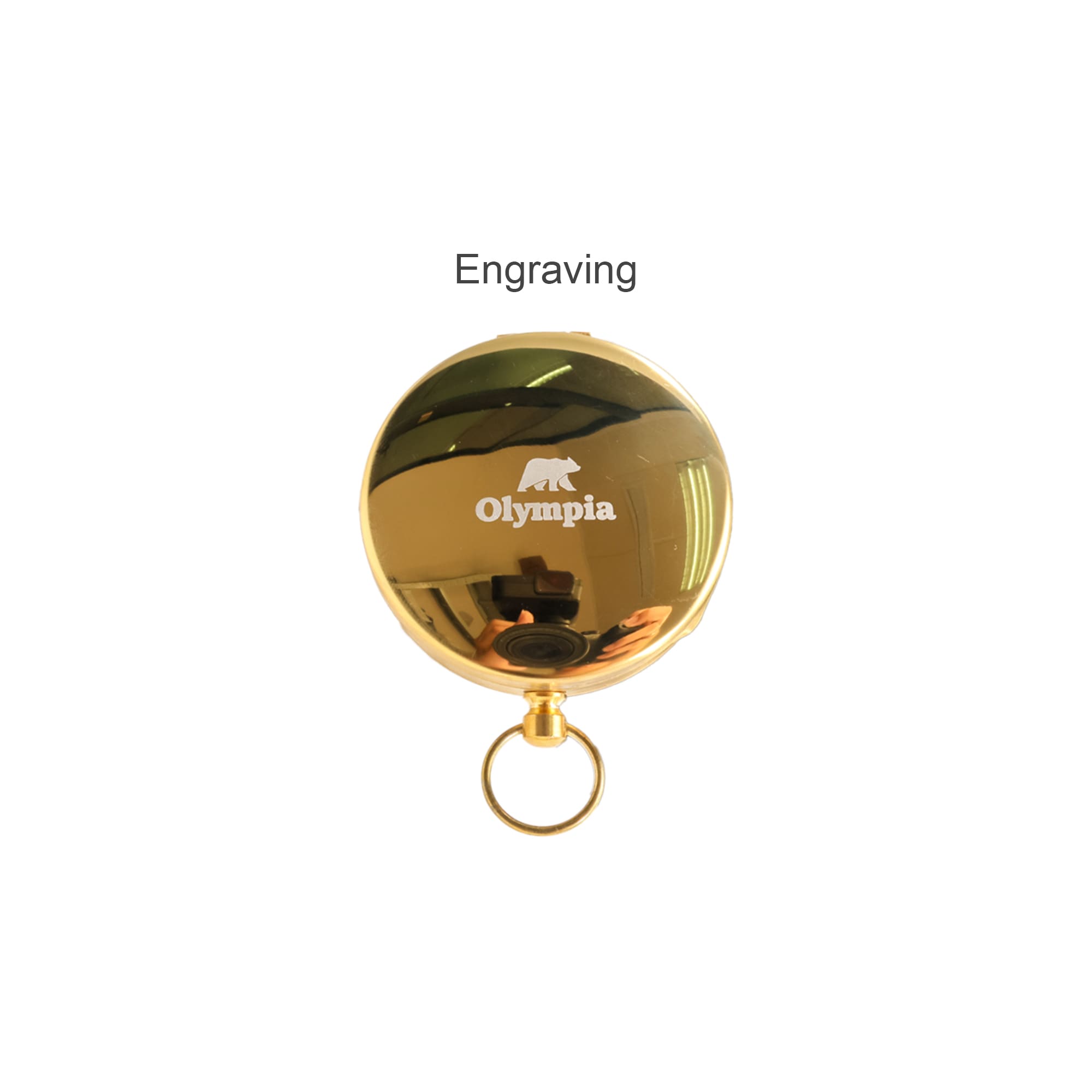 A gold pocket compass with a shiny finish, featuring a logo and a keyring attachment.