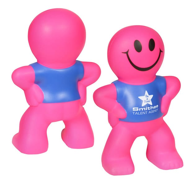 A pink stress reliever in the shape of a smiling humanoid figure with a blue shirt and a logo.
