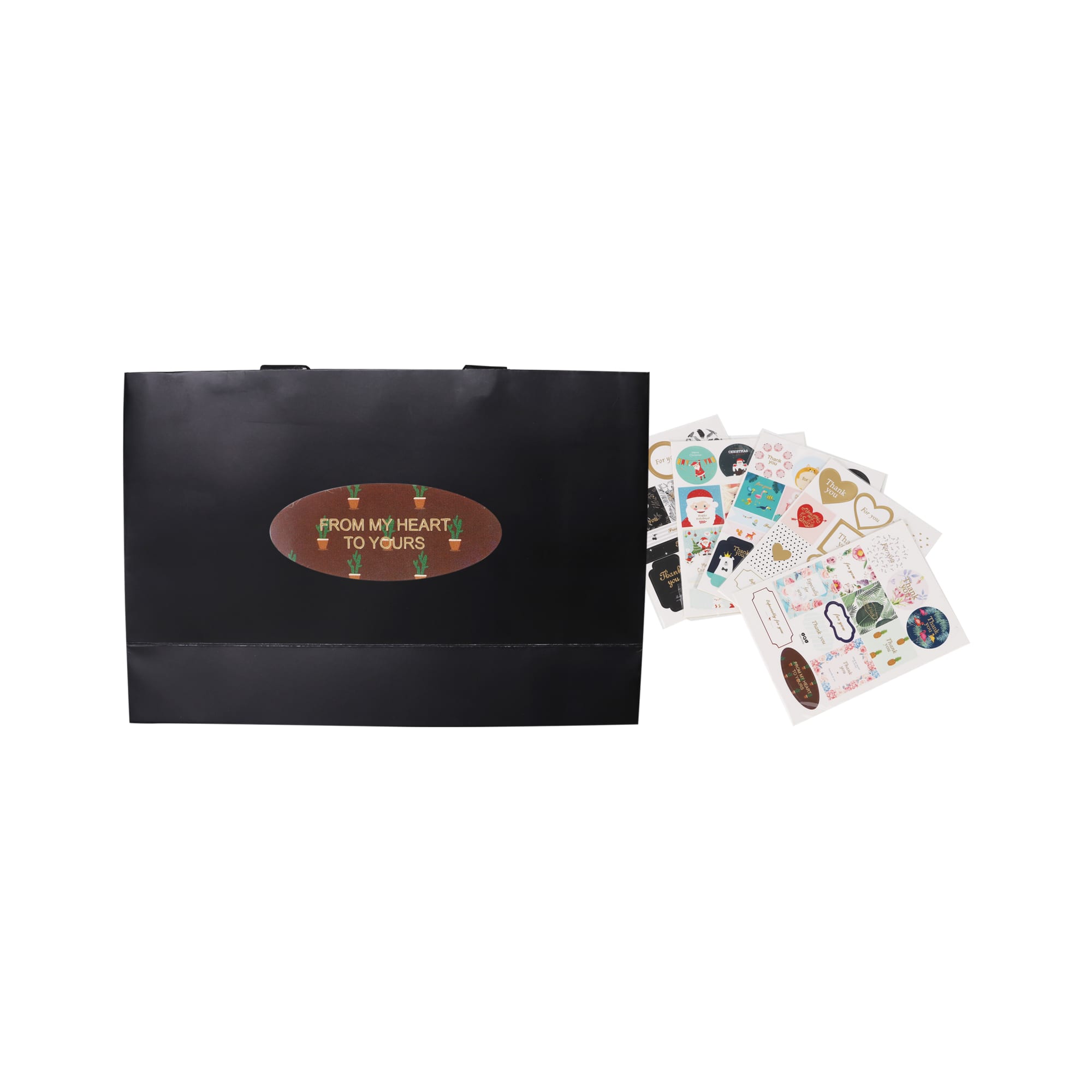 A black small paper bag with flat handles alongside various decorative stickers.