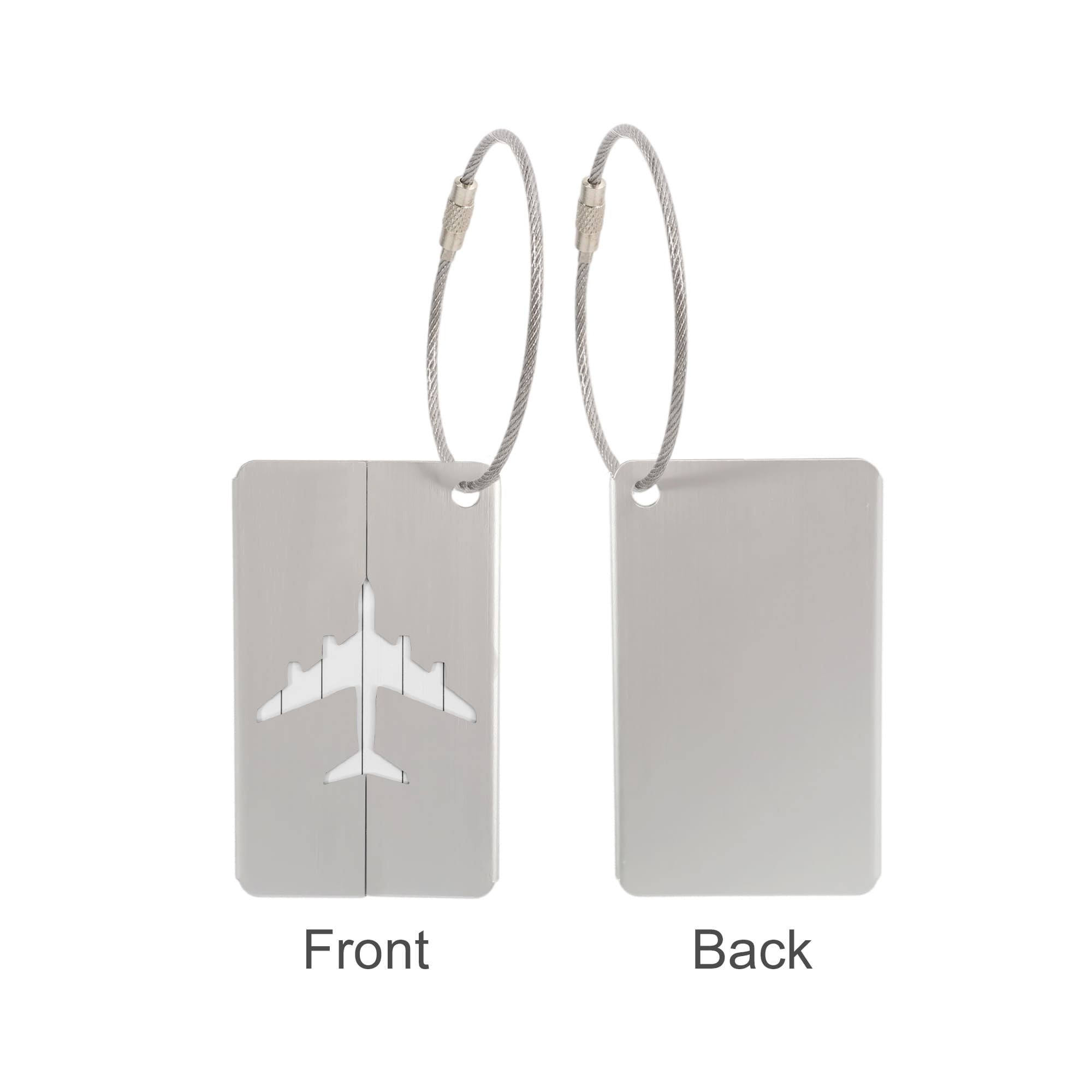 A silver luggage tag with an airplane design on one side and a plain back, featuring a wire cable attachment.